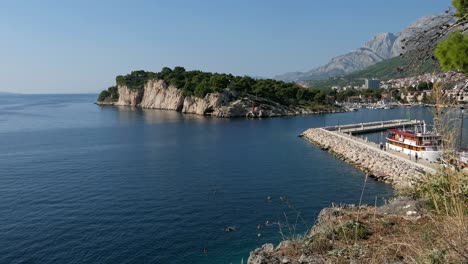 Swimmers-in-Mediterranean-beach,-afternoon-swimming-in-European-beach,-Croatia