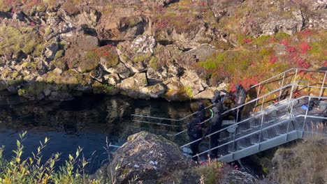 People-ready-to-snorkel-in-Silfra-fissure-of-Thingvellir-Park,-Iceland