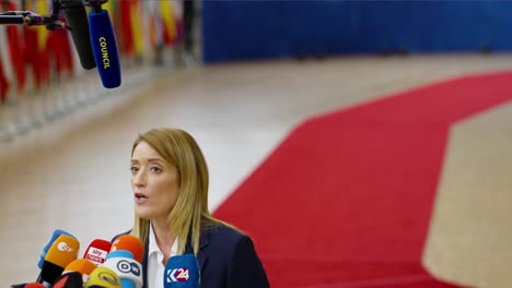 President-of-the-European-Parliament-Roberta-Metsola-talking-to-the-press-at-the-EU-Council-summit-in-Brussels,-Belgium---Close-view,-Slow-motion