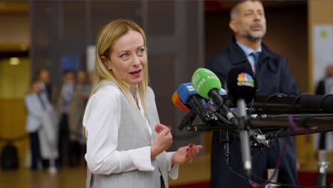 Italian-Prime-Minister-Giorgia-Meloni-talking-to-the-press-at-the-European-Council-conference-in-Brussels,-Belgium---Profile-shot,-Slow-motion
