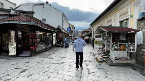 SARAJEVO:-Bazaar-Strolls,-Gazi-Husrev-beg-Mosque,-Clock-Tower,-Street-Performances,-Cobblestone-Streets,-Street-Performances,-Iconic-Landmarks,-Burek,-Cultural-Heritage,-Explore