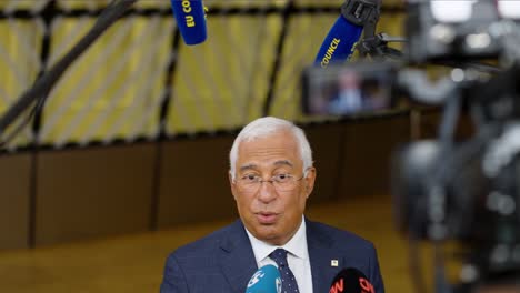 Portuguese-Prime-Minister-António-Costa-talking-to-the-press-at-the-European-Council-summit-in-Brussels,-Belgium---Close-shot,-slow-motion