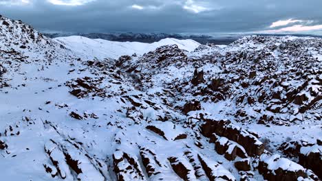 Wide-cinematic-shot-of-the-snow-covered-landscape-of-the-Alabama-Hills,-California