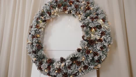 Frosted-pinecone-wreath-with-star-lights