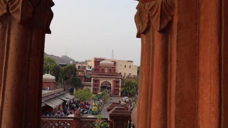 people-walking-at-city-street-near-historic-entrance-gate-at-day-from-different-angle-video-is-taken-at-sardar-market-ghantaGhar-jodhpur-rajasthan-india-on-Nov-06-2023