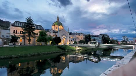 SARAJEVO:-Strolling-along-the-Miljacka-River-with-a-view-of-the-Schools-of-Fine-Arts-in-Sarajevo