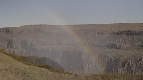 Iceland-canyon-with-faint-rainbow