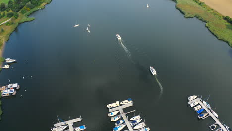 Aerial-shot-of-drone-flying-around-marina-in-Blotnik,-Pomeranian,-Poland-with-yachts-in-the-background