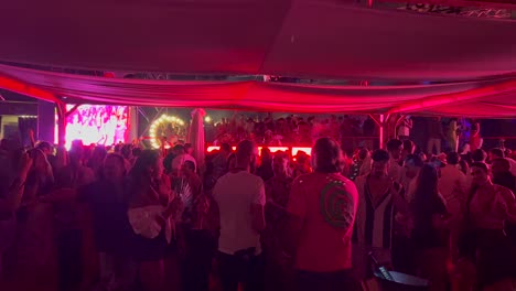 People-dancing-to-music-and-having-fun,-nightlife-in-Marbella,-best-party-vibes-in-Spain,-4K-shot