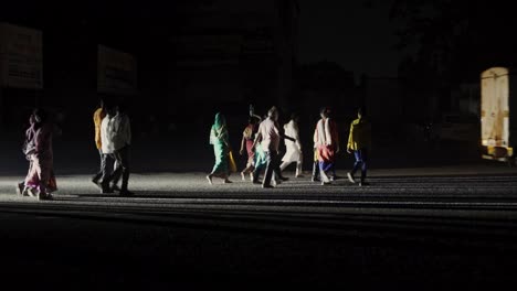 Indian-pedestrians-crossing-the-road-early-morning,-Trimbakeshwar