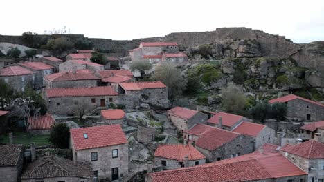 View-from-Sortelha-Castle-and-wall-in-Sabugal-to-the-village,-pan-left