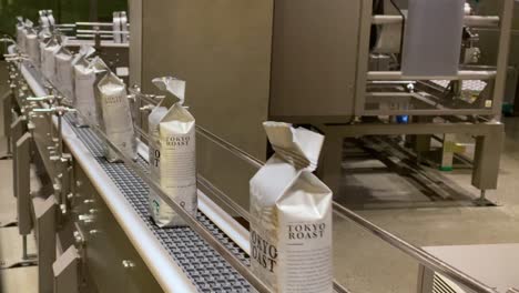 Still-shot-of-automated-packaging-production-line-of-Starbucks-coffee-beans