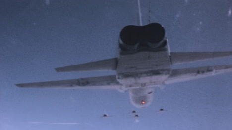 Rear-Underside-View-of-US-Fighter-Jet-in-Formation-Flight---1960s-Pilot-POV