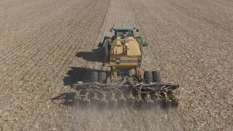 Tractor-with-Strip-Till-Machine-Performing-Strip-Tillage-to-Prepare-Farm-Field-for-Planting,-Aerial
