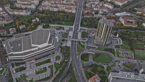 Prague-Czechia-Aerial-v121-birds-eye-view-drone-flyover-modern-Congress-centre-on-the-edge-of-Nusle-valley,-capturing-traffics-on-Nuselsky-most-bridge---Shot-with-Mavic-3-Cine---November-2022