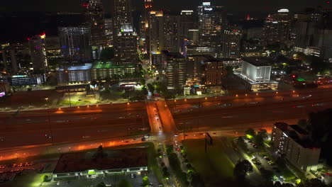 Aerial-time-lapse-of-traffic-in-city-at-night