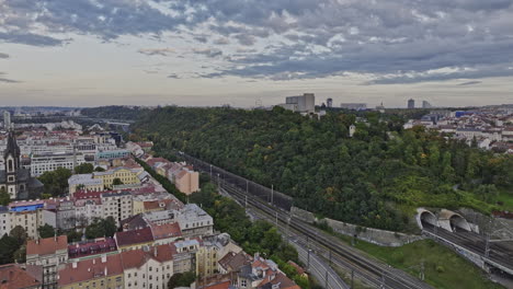 Prague-Czechia-Aerial-v85-cinematic-low-level-drone-flyover-Karlin-neighborhood-across-Vitkov-Hill-memorial-park,-reveals-Zizkov-cityscape-views---Shot-with-Mavic-3-Cine---November-2022