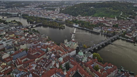 Prague-Czechia-Aerial-v83-birds-eye-view-drone-reverse-flyover-Old-town-district-away-from-landmark-Charles-bridge-capturing-full-cityscape-along-Vltava-river---Shot-with-Mavic-3-Cine---November-2022