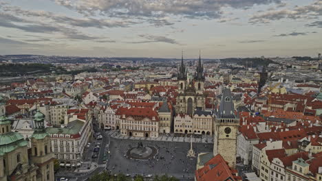 Prague-Czechia-Aerial-v84-dramatic-drone-flyover-old-town-square,-fly-in-between-the-gothic-towers-of-Church-of-Our-Lady-before-Tyn-capturing-cityscape-views---Shot-with-Mavic-3-Cine---November-2022