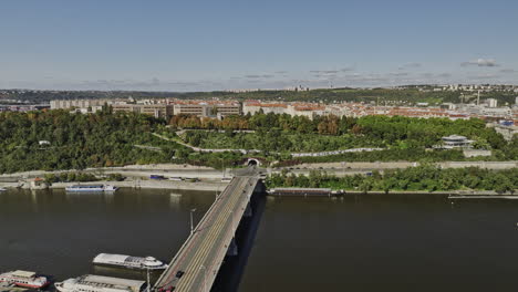Prague-Czechia-Aerial-v57-drone-flyover-Petrska-Ctvrt-along-Stefanikuv-Most-Bridge-across-Vltava-river-towards-Letna-park-capturing-Holesovice-cityscape---Shot-with-Mavic-3-Cine---November-2022