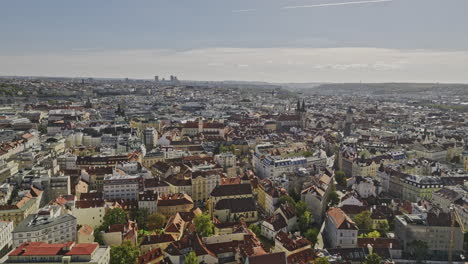 Prague-Czechia-Aerial-v60-flyover-Old-Town-capturing-cityscape-views-of-riverside-Petrska-Ctvrt-neighborhood,-Vltava-River-and-Stvanice-Island-on-a-sunny-day---Shot-with-Mavic-3-Cine---November-2022