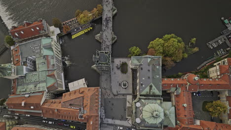 Prague-Czechia-Aerial-v113-cinematic-vertical-top-down-view,-drone-flyover-Vltava-river-along-Charles-bridge-from-Old-Town-towards-Malá-Strana-Lesser-Town---Shot-with-Mavic-3-Cine---November-2022