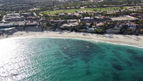 Aerial-along-coast-of-Palmilla-Beach-in-Cabo-San-Lucas,-an-slice-of-paradise-on-the-southern-tip-of-the-Baja-California-Peninsula