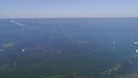 4K-Drone-Video-of-Beach-Park,-Marina,-and-Waterfront-Homes-in-Hudson-Beach-on-the-Gulf-of-Mexico-in-Florida