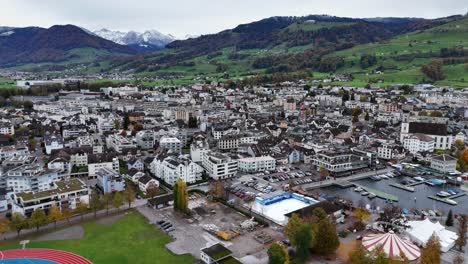 Lachen-city-establishment-drone-overview,-Swiss-village-mountain-landscape