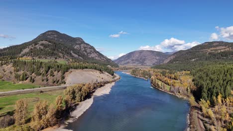 Autumn-Majesty:-Scenic-Aerial-Footage-of-Thompson-River-and-Forested-Mountains