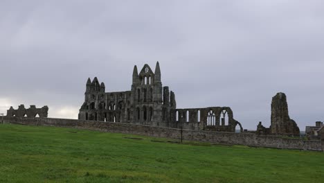 Static-shot-of-the-famous-Whitby-Abbey-ruins-remaining-in-Yorkshire-on-a-cloudy-day