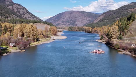 Golden-Canopy:-Thompson-River-Aerials-with-Cable-Ferry-and-Forested-Mountains-in-Autumn