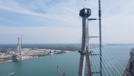 Gordie-Howe-international-bridge-under-construction-process,-aerial-drone-view