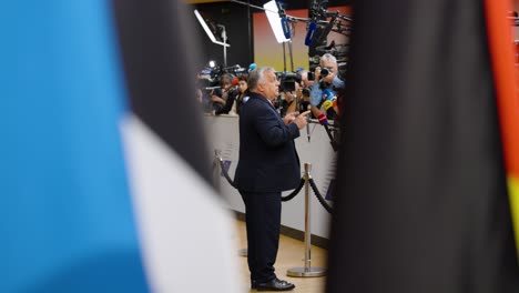 Hungarian-Prime-Minister-Viktor-Orbán-talking-to-the-press-and-saying-goodbye-at-the-European-Council-summit-in-Brussels,-Belgium---Cinematic-profile-shot