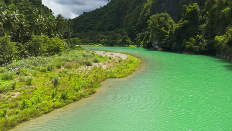 Aerial-fly-over-of-the-twisting-Daywan-River,-Philippines