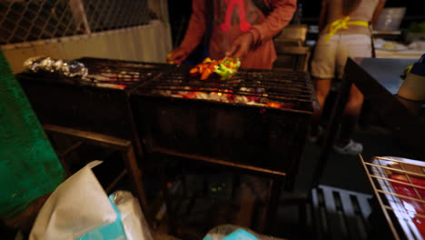 Grilling-street-food-in-Thailand,-cinematic-motion-forward-view