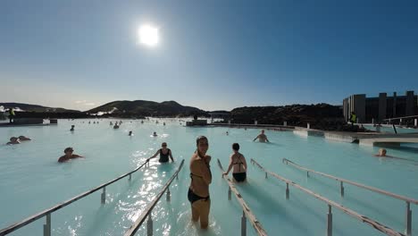slow-tracking-shot-of-tourists-entering-and-leaving-the-blue-lagoon-spa-in-Iceland