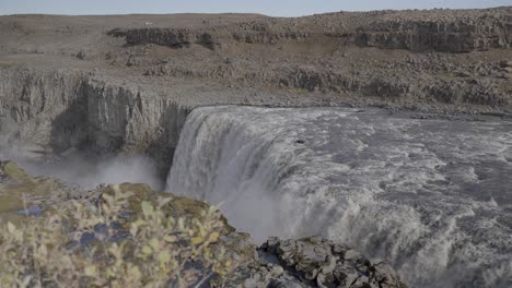 The-cascading-waters-of-Dettifoss,-a-waterfall-nestled-in-Northeast-Iceland