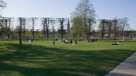 Copenhagen's-Rosenborg-Park-with-people-relaxing-on-a-sunny-day