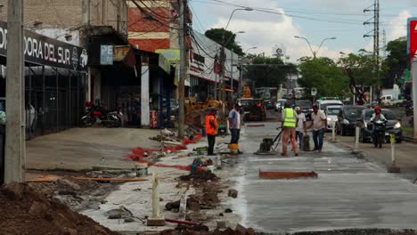 Timelapse,-Concrete-Works-For-Road-Construction-With-Many-Workers-In-Paraguay