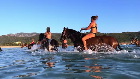 Summertime-joyful-horseback-ride-in-the-sea