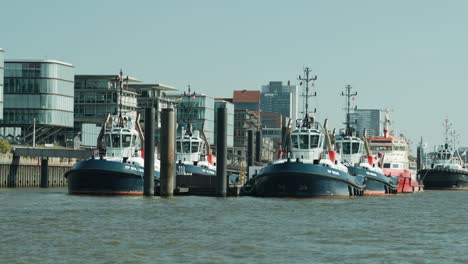Tugboat-docked-waiting-for-their-next-assignment-in-Hamburg
