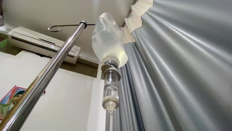 Intravenous-drip-hose-on-the-ward-room-with-curtain