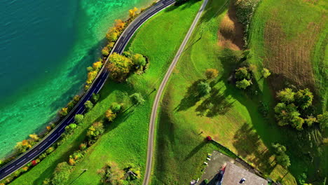 Aerial-view-of-the-green-shores-of-the-clear-lake-Attersee,-in-Austria