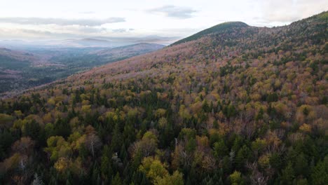 Autumn-aerial-view-over-Grafton-Notch-State-Park-colorful-forest-on-hill
