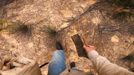 Point-of-view-shot-of-a-swagman-walking-in-boots-through-the-Australian-outback