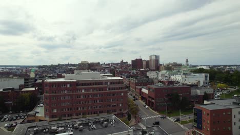 Aerial-Shot-Of-Portland-In-Maine,-People-And-Cars-At-A-City-Intersection