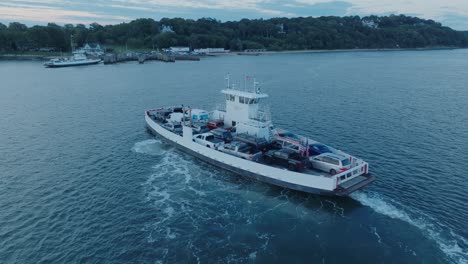 Aerial-Drone-shot-of-Ferry-approaching-Shelter-Island-North-Fork-Long-Island-New-York-before-sunrise