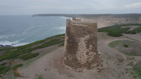 Aerial-view-in-orbit-over-the-Flumentorgiu-tower-on-the-island-of-Sardinia-and-close-to-Corsario-beach