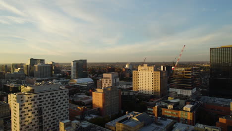 Aerial-view-ascending-in-front-of-the-Drexel-University,-sunset-in-Philadelphia